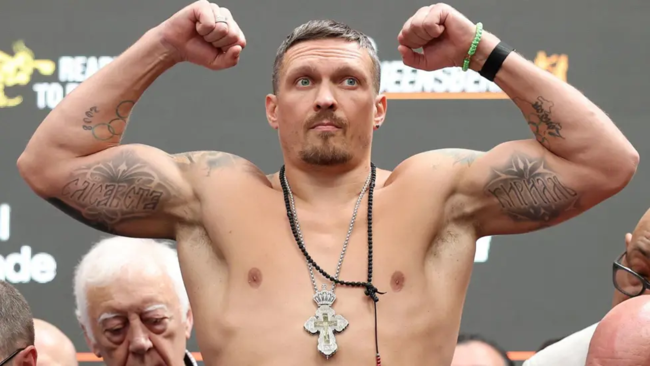 Usyk to defend title against kickboxer in Egypt Oleksandr Usyk flexing his biceps